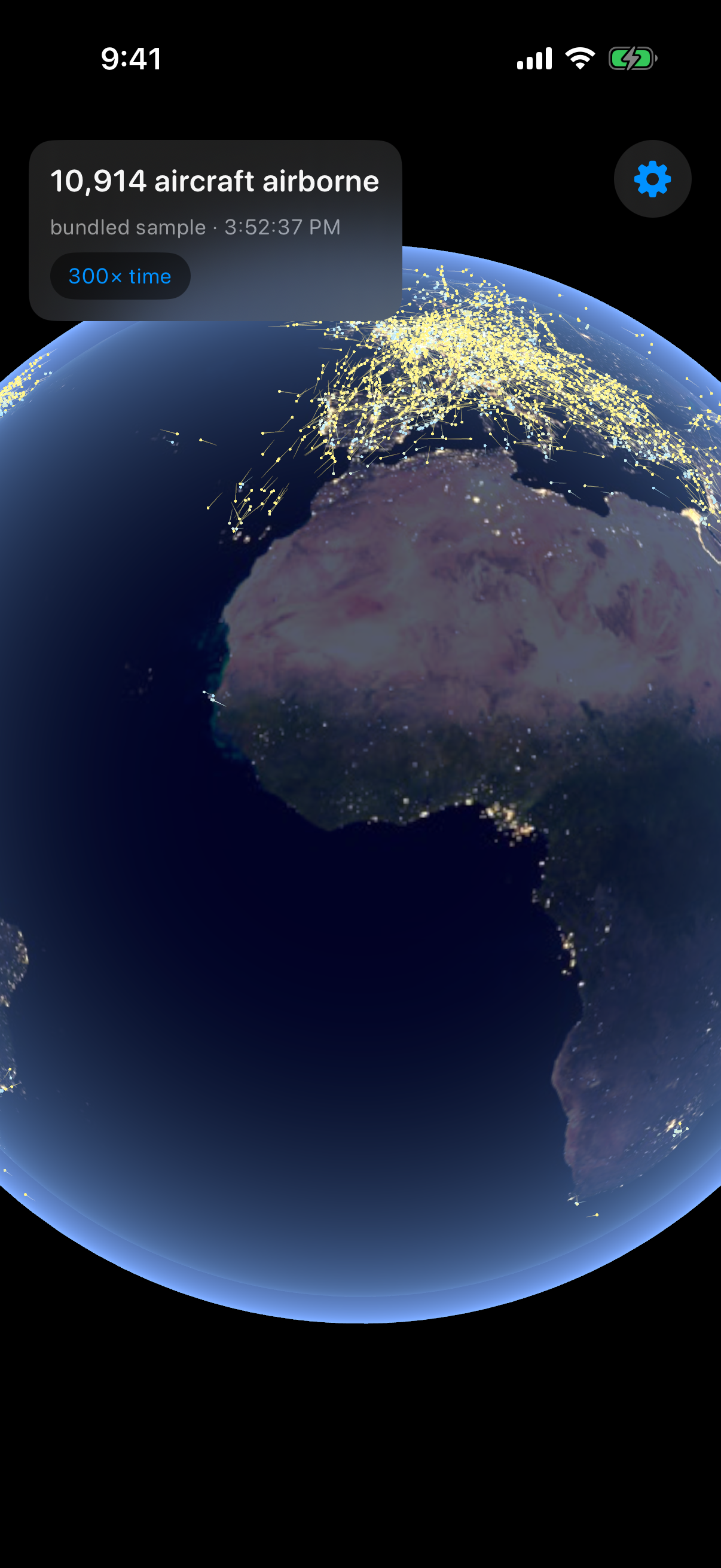 Night side of the globe with city lights and flight trails